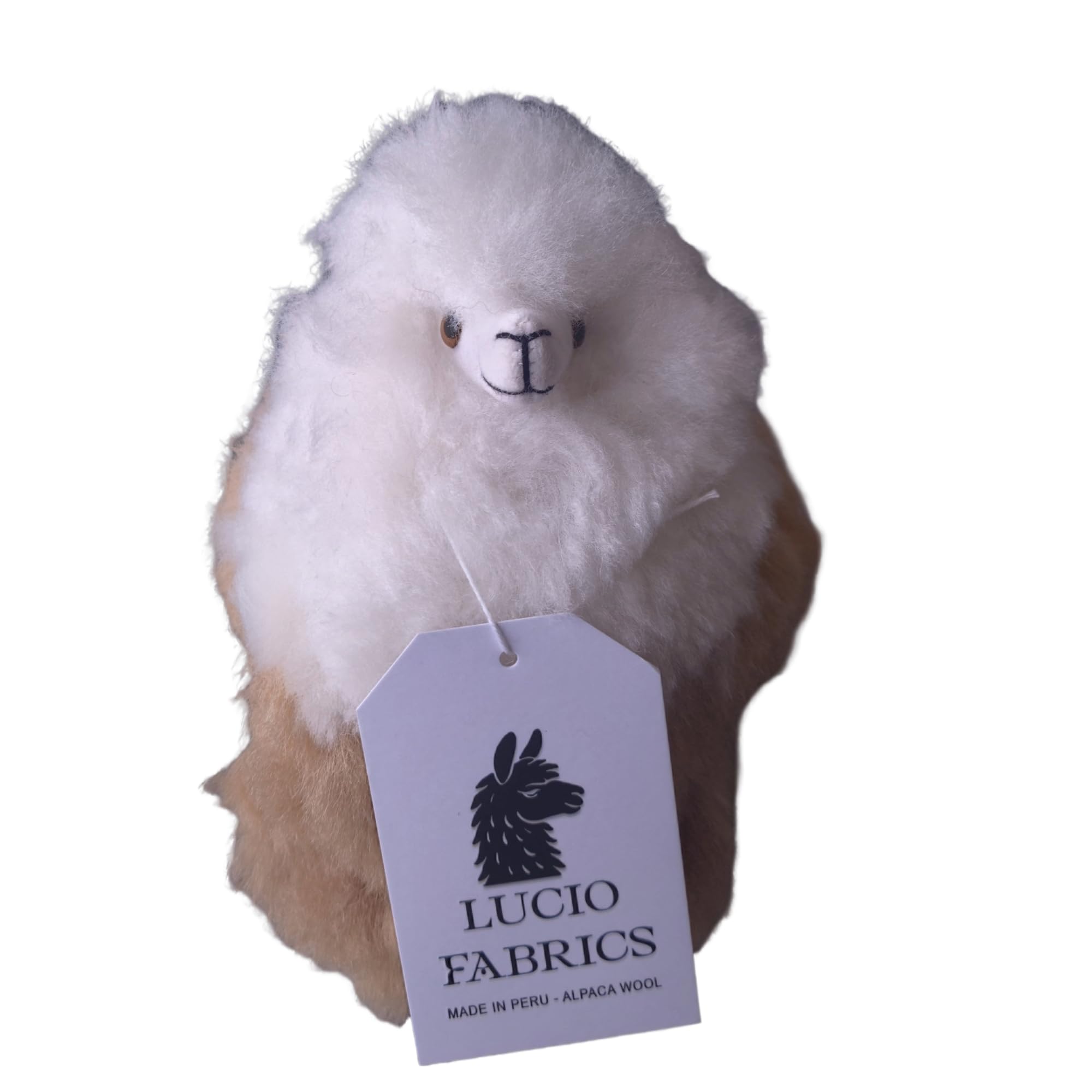 Plush alpaca toy with a Lucio Fabrics tag on a white background