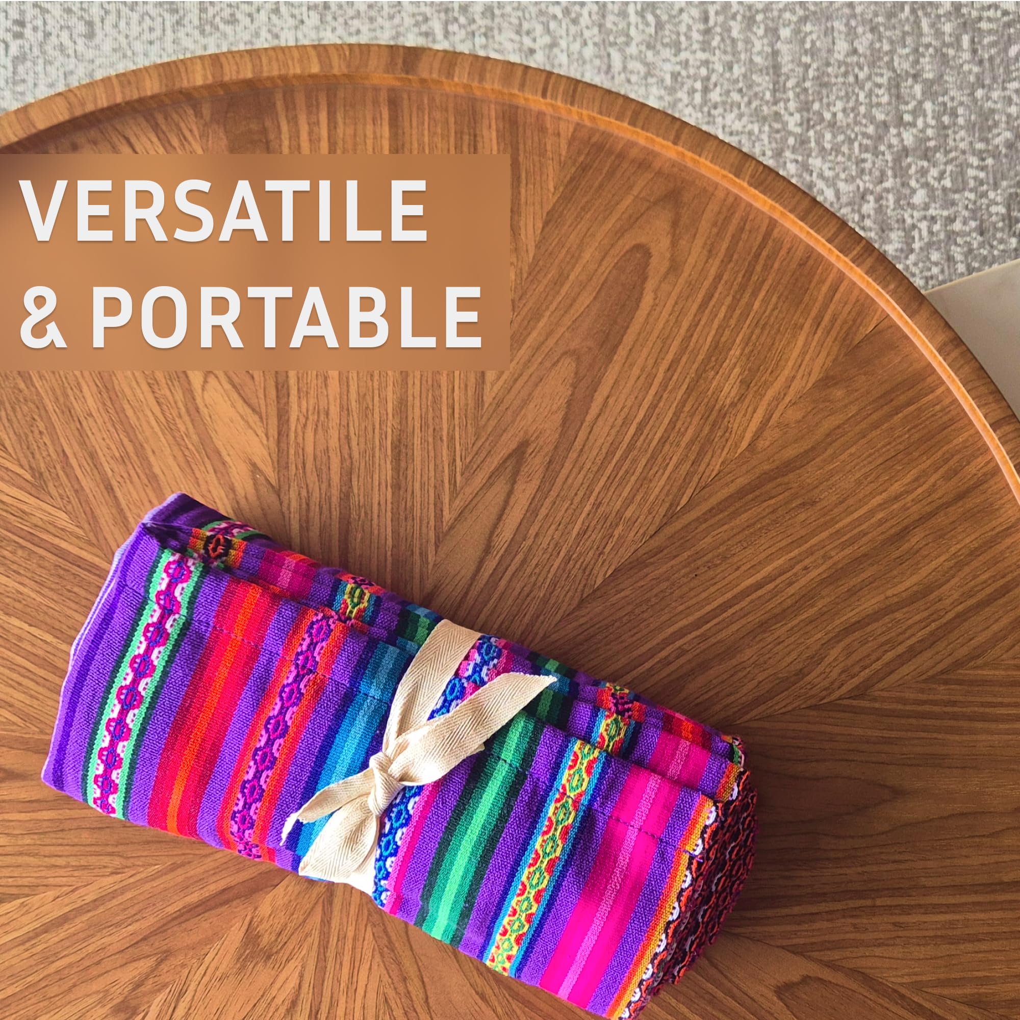 Colorful striped bag with a bow on a wooden table, text 'VERSATILE & PORTABLE' above.