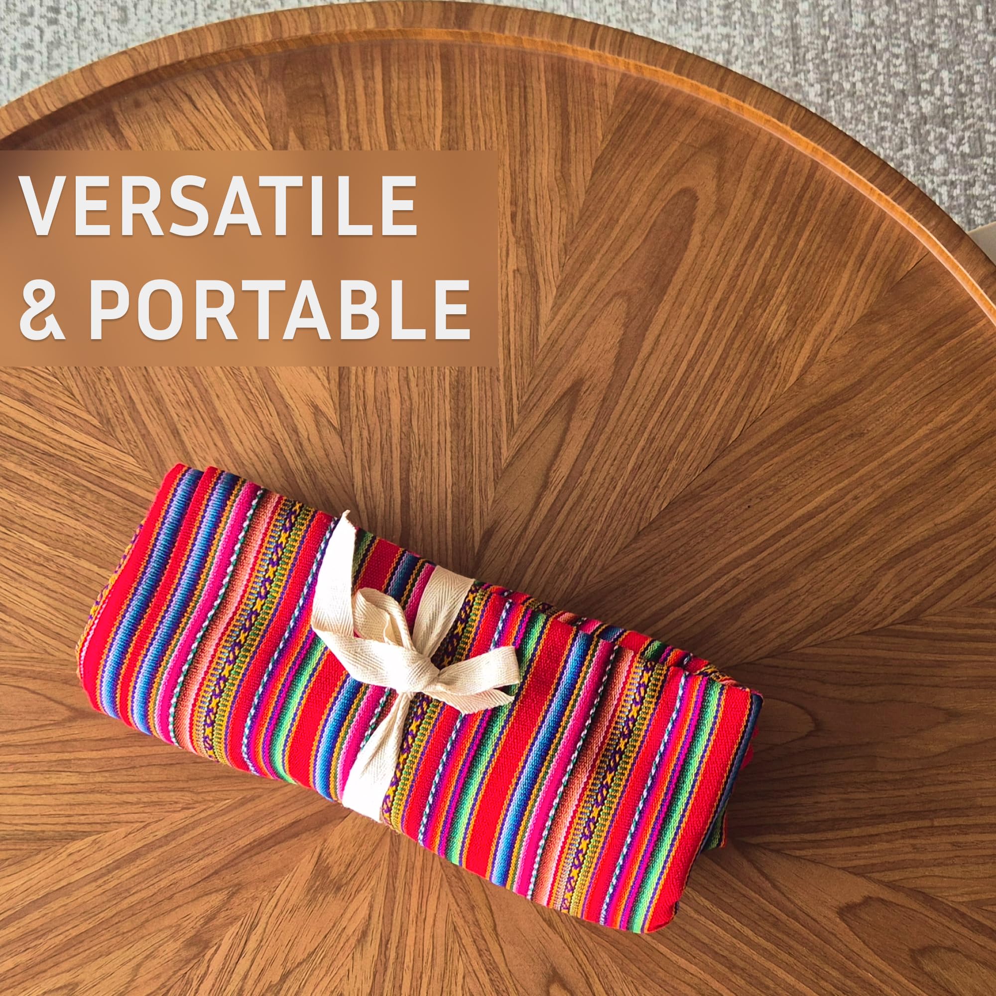 Colorful striped clutch with a bow on a wooden table, text 'VERSATILE & PORTABLE' above.