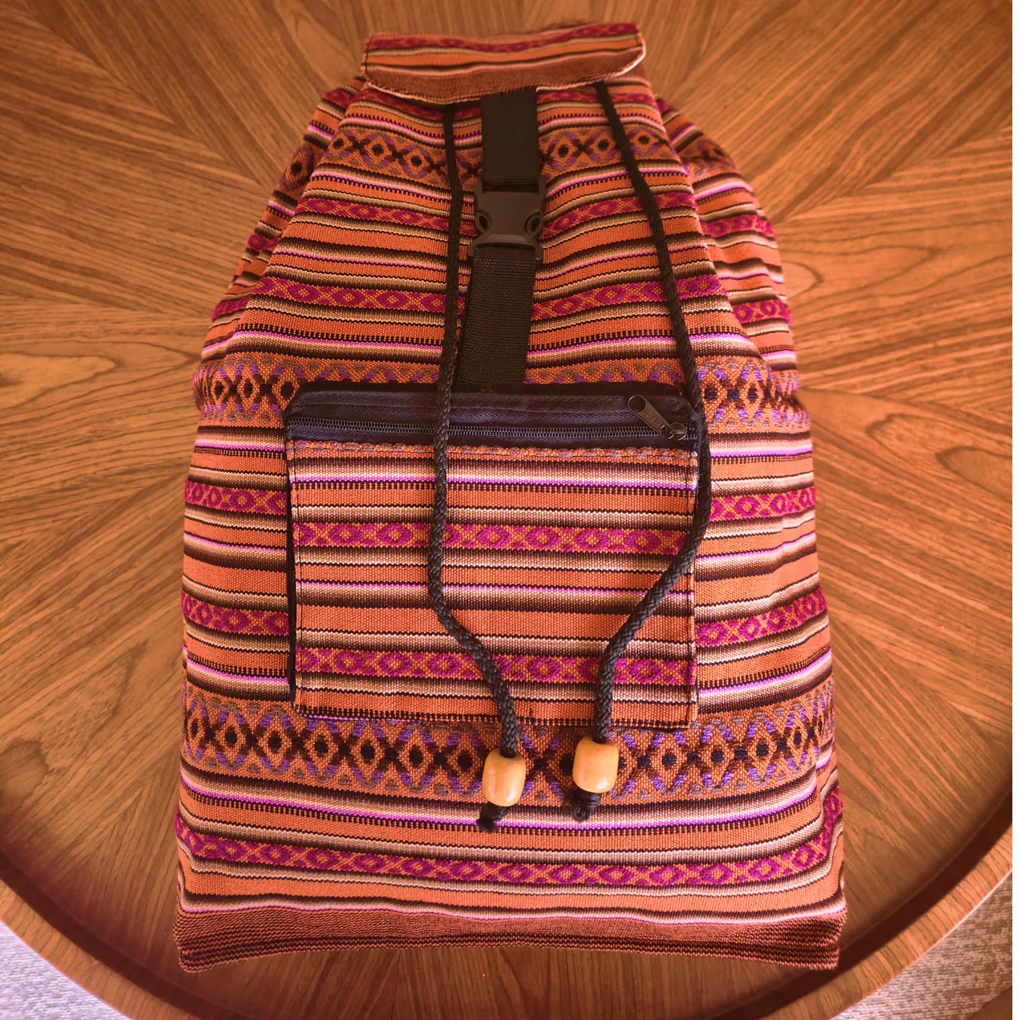 Colorful patterned backpack on a wooden surface