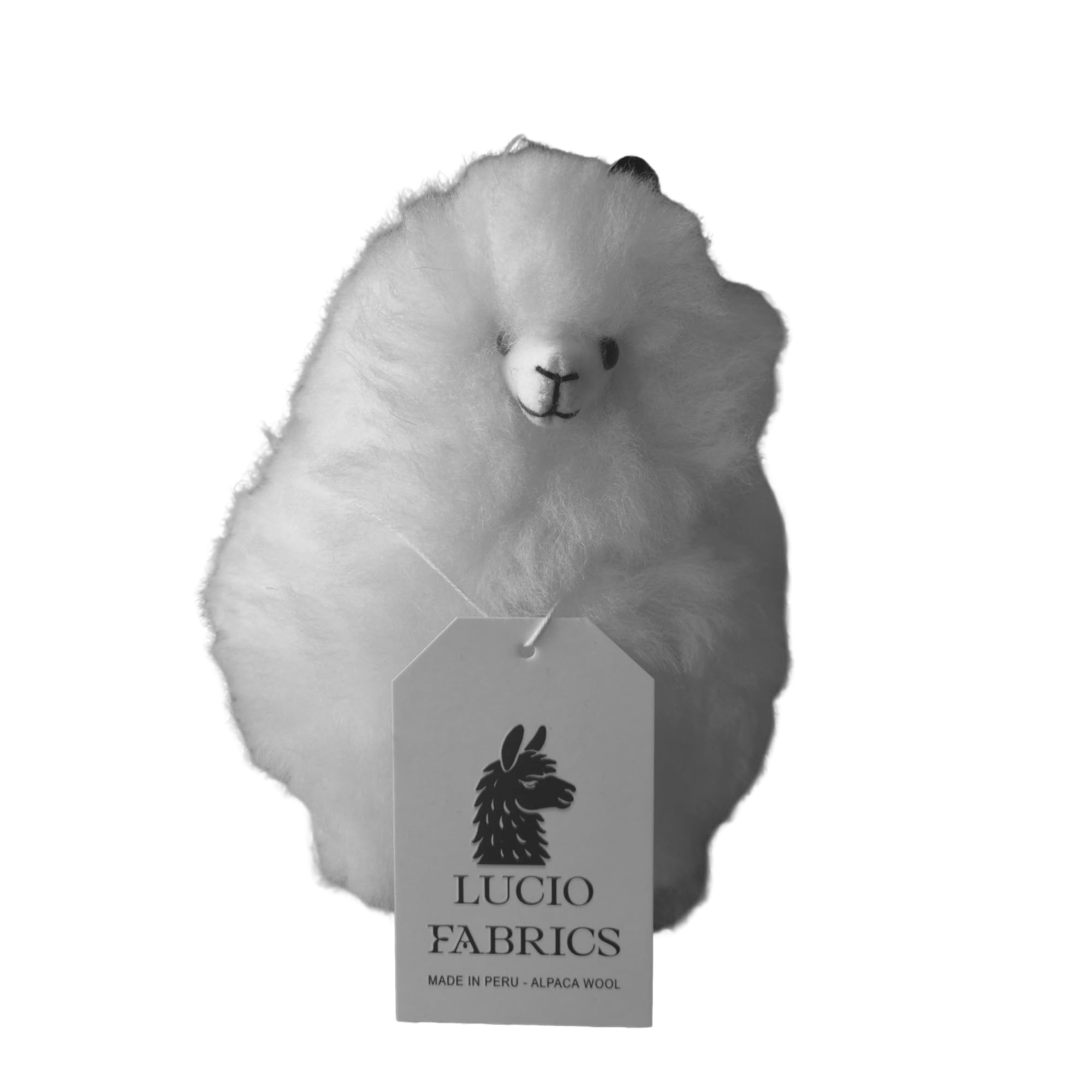 White alpaca-shaped fabric sample with Lucio Fabrics tag on a white background