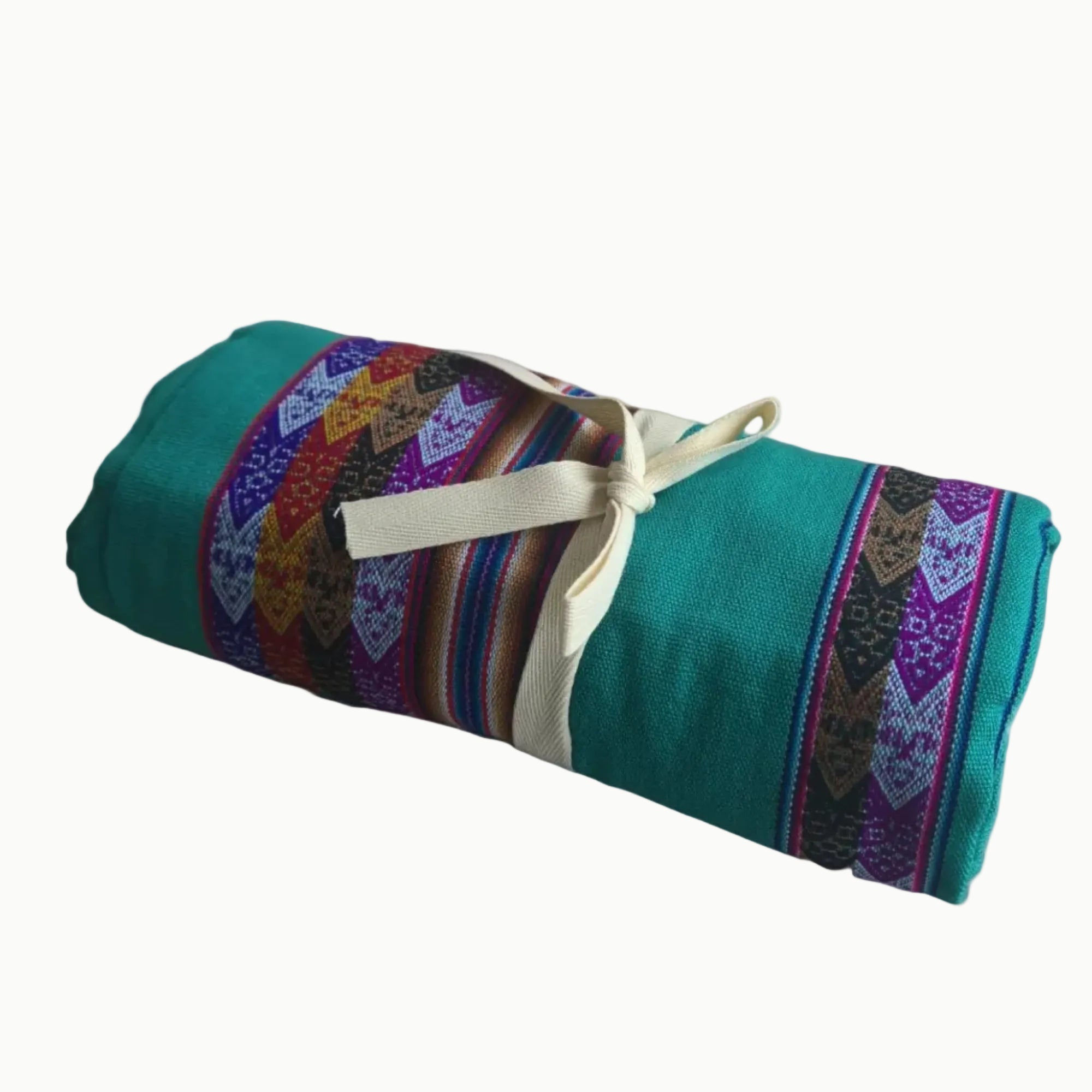 Rolled-up colorful fabric with geometric patterns on a white background