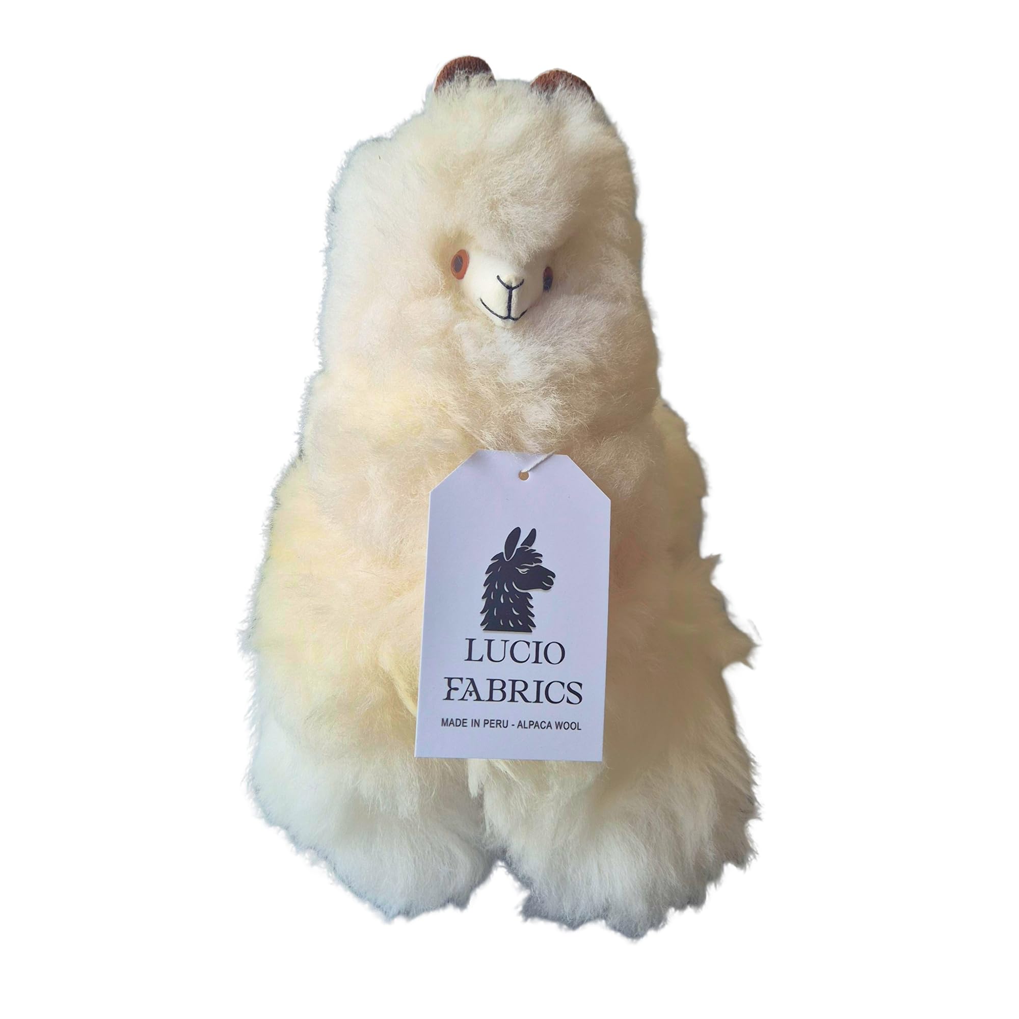Stuffed alpaca toy with Lucio Fabrics tag on a white background