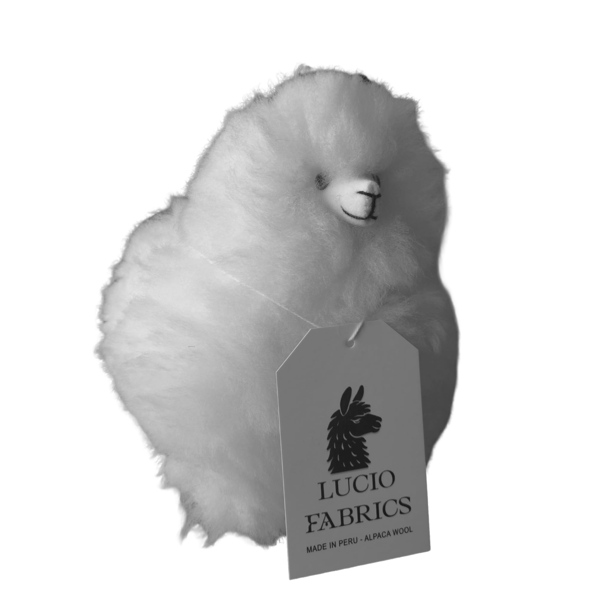 Alpaca fiber with Lucio Fabrics tag on a white background