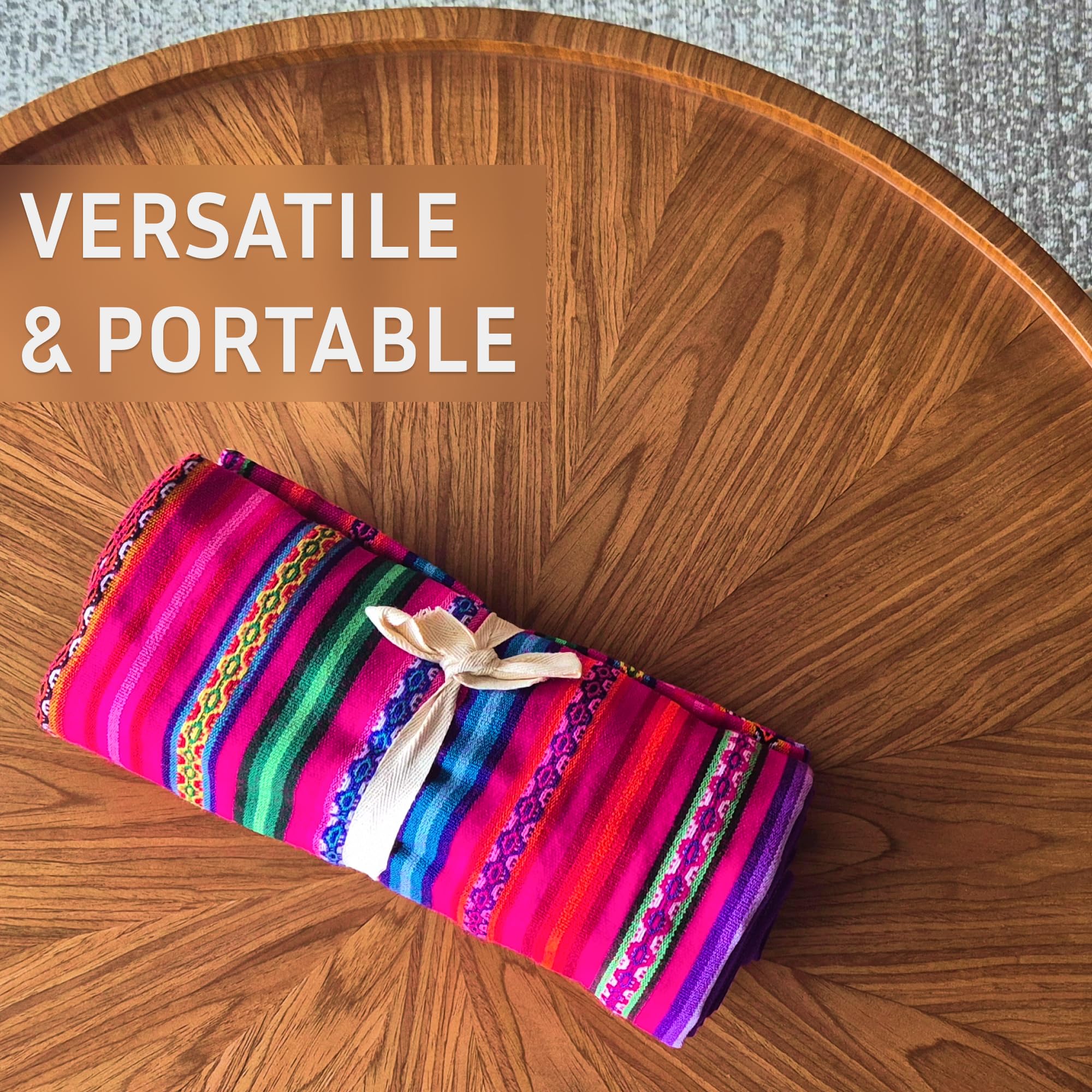 Colorful striped fabric roll on a wooden surface with 'VERSATILE & PORTABLE' text.