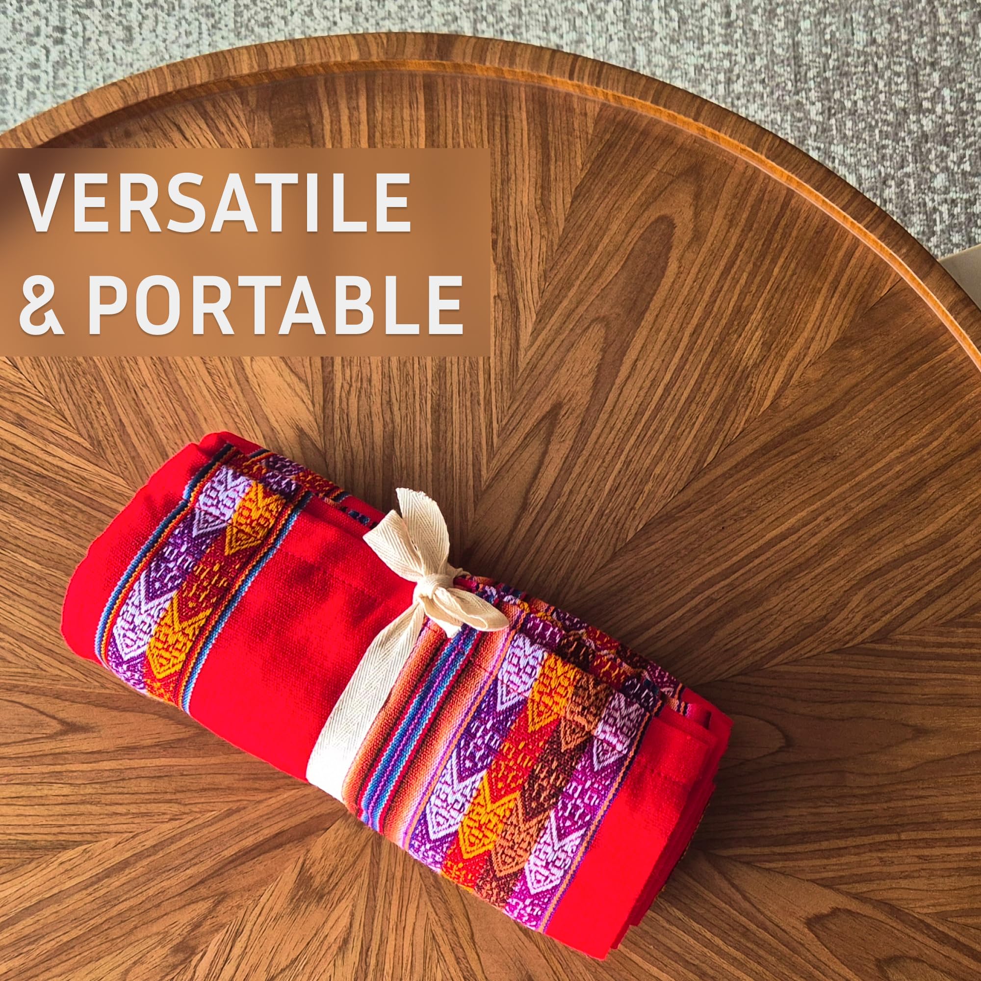 Colorful fabric roll on a wooden table with 'VERSATILE & PORTABLE' text