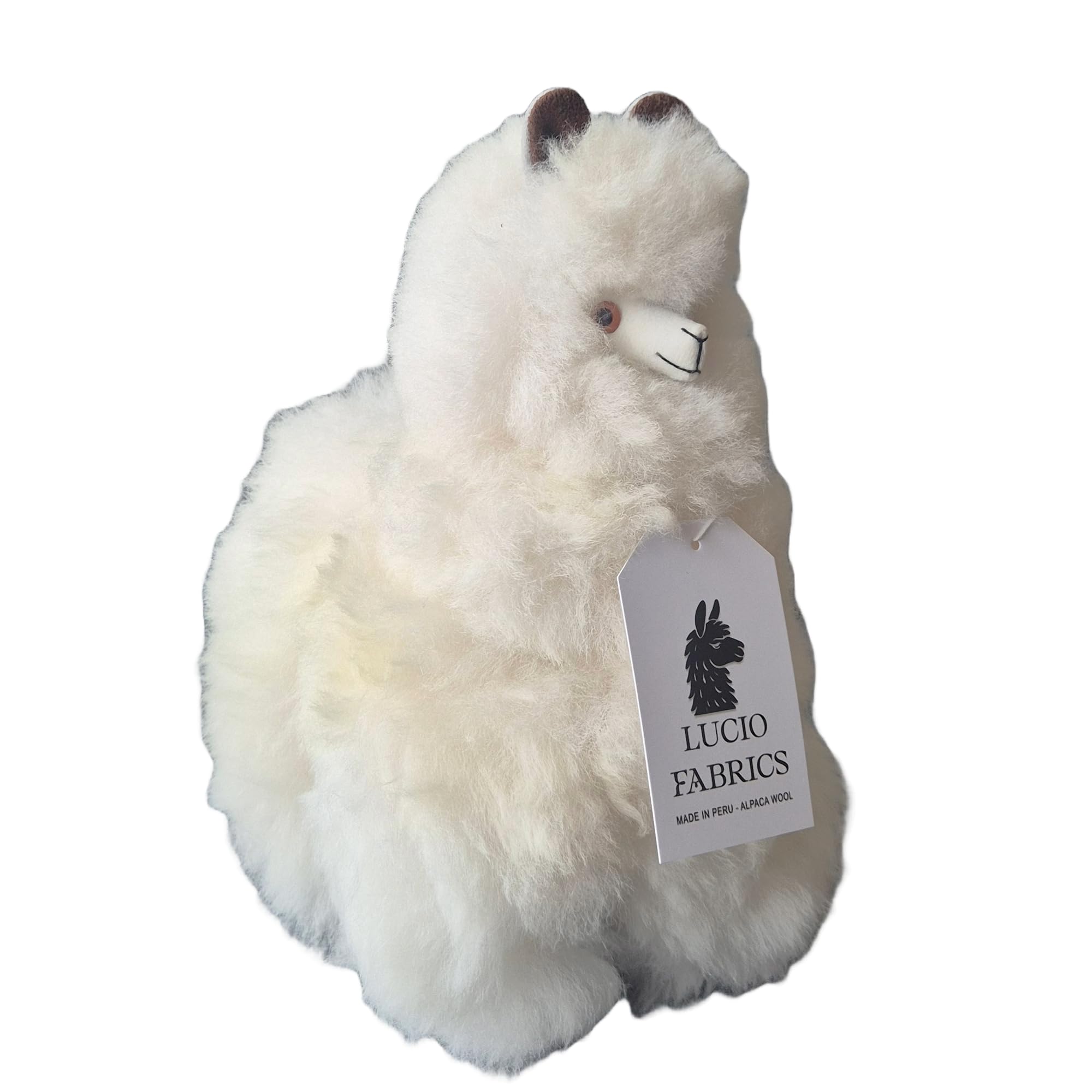 Plush white alpaca with a Lucio Fabrics tag on a white background